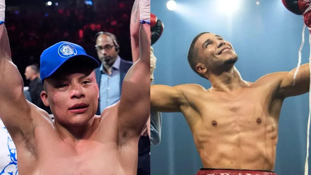Dos boxeadores levantando los brazos tras la victoria
