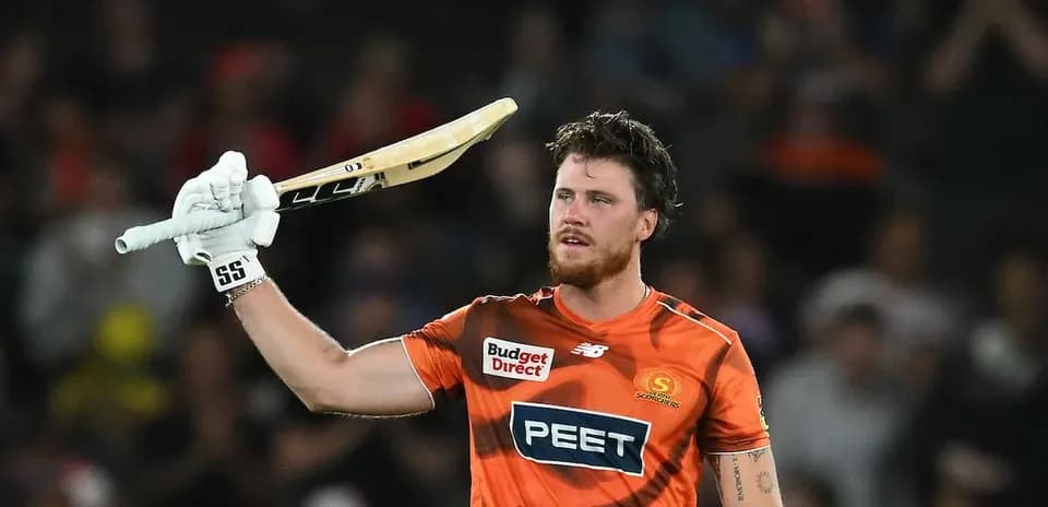 Jugador de cricket levantando su bate en celebración