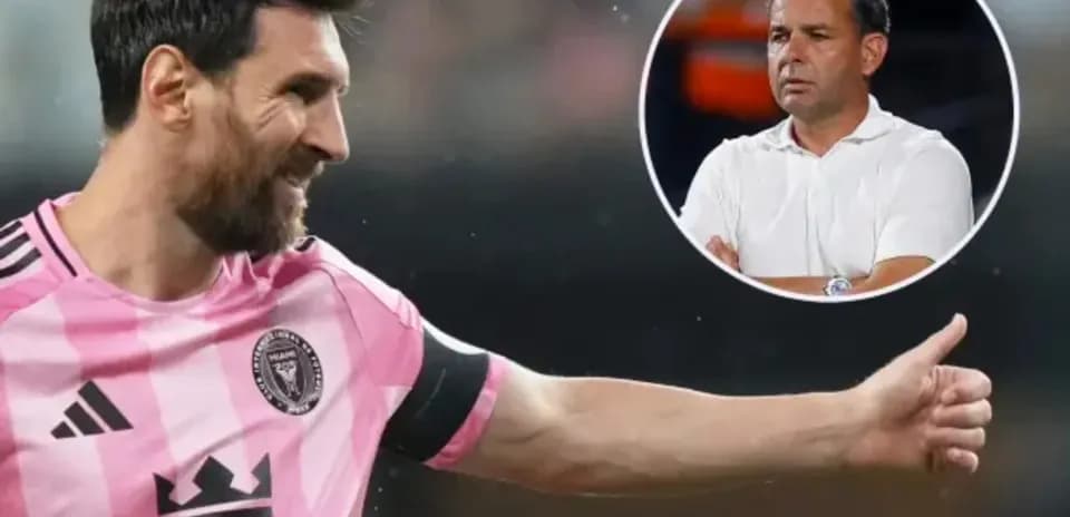 Lionel Messi gesturing during a match with coach in background