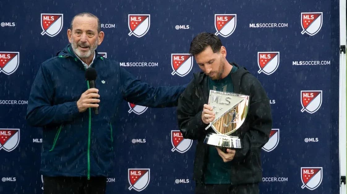 Lionel Messi holding MLS trophy during presentation ceremony Lionel Messi holding MLS trophy during presentation ceremony