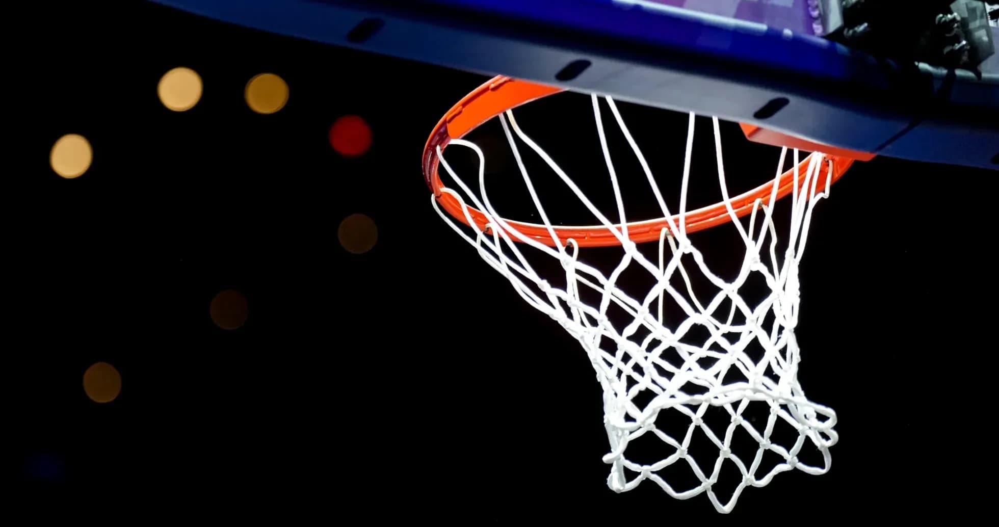 A close-up of a basketball hoop and net