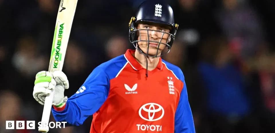 Jugador de cricket levantando el bate en celebración