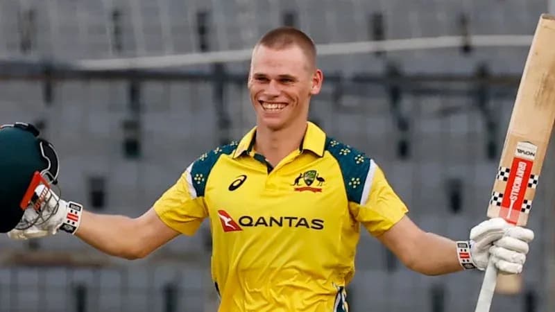 Jugador de cricket celebrando con bate en mano