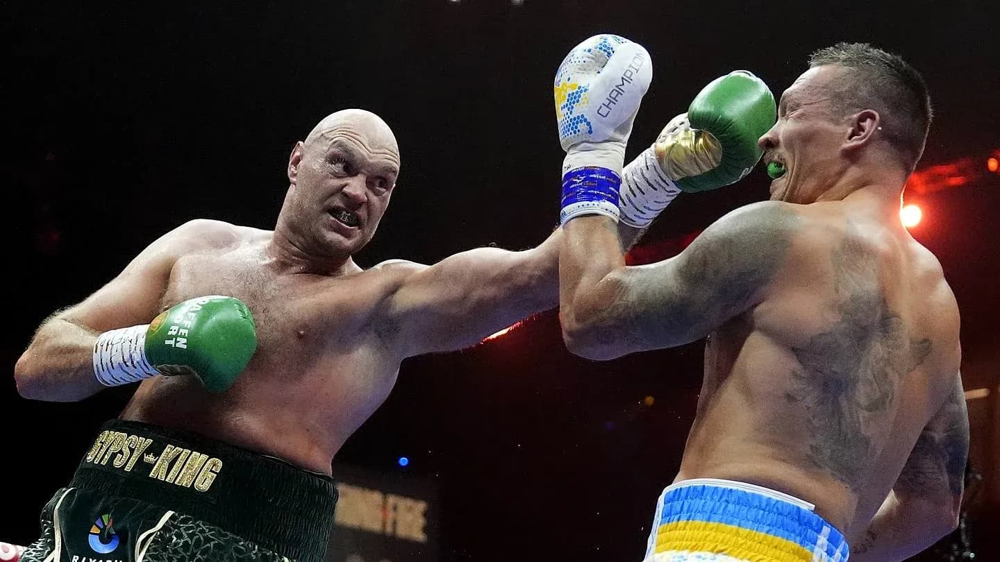Tyson Fury and Oleksandr Usyk boxing in the ring Tyson Fury and Oleksandr Usyk boxing in the ring